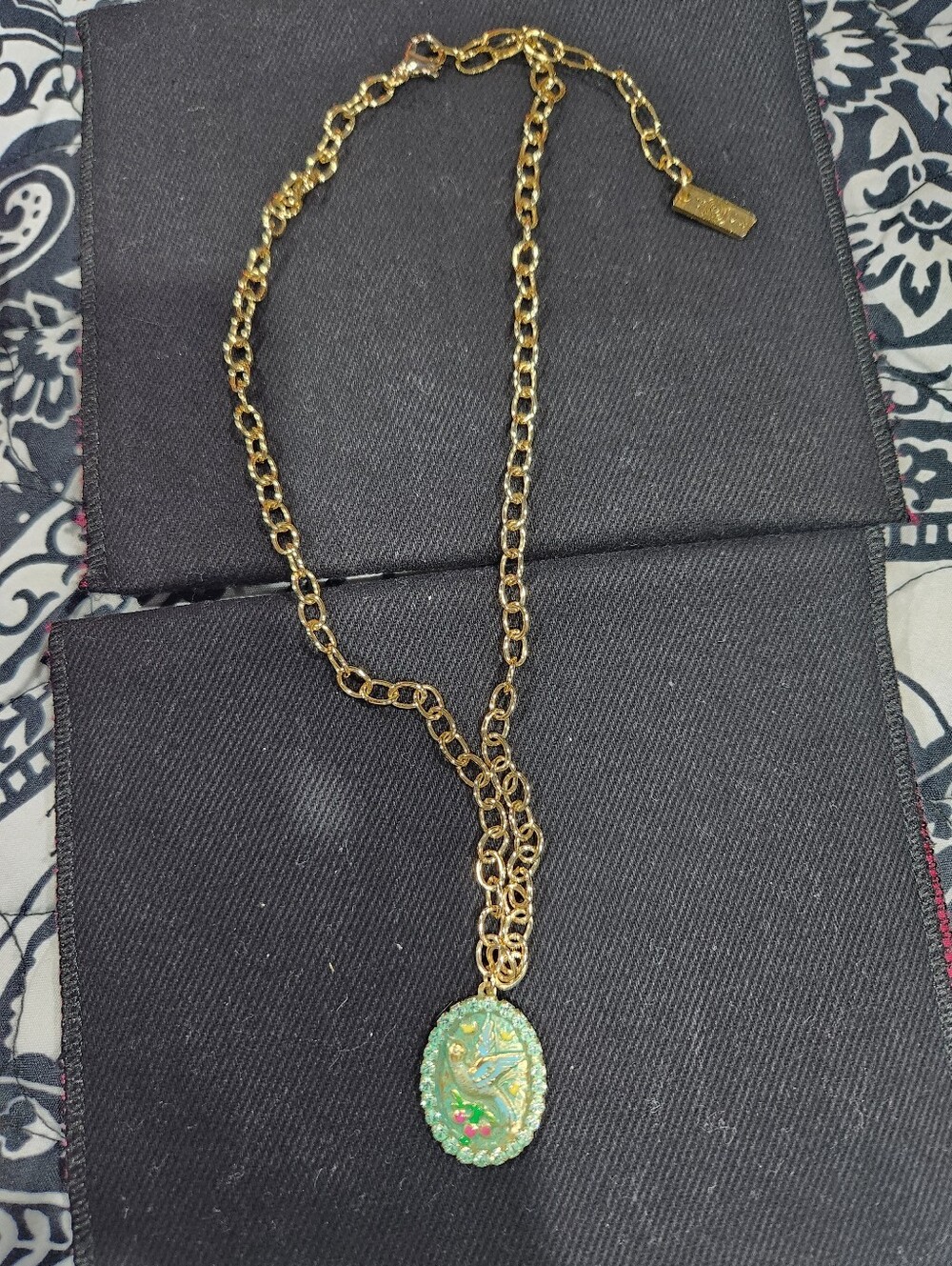 Tova Gold-Tone Necklace with Green Dove Pendant .
